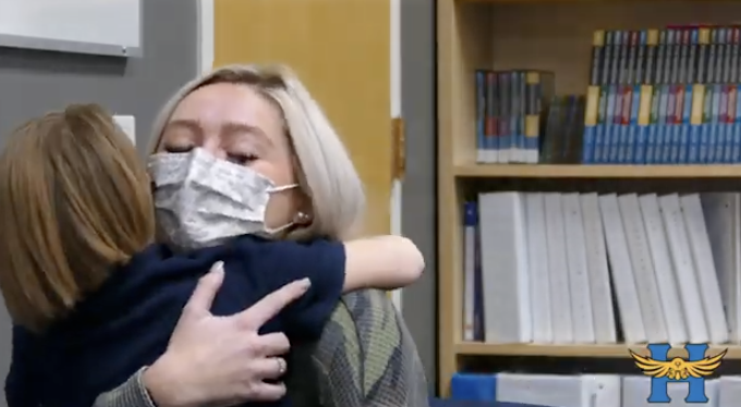 Student Hugging Teacher